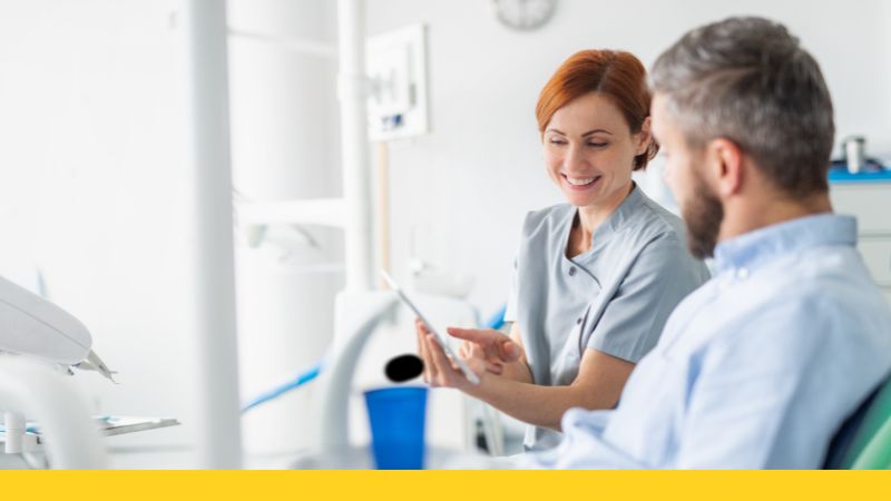 dental assistant with patient