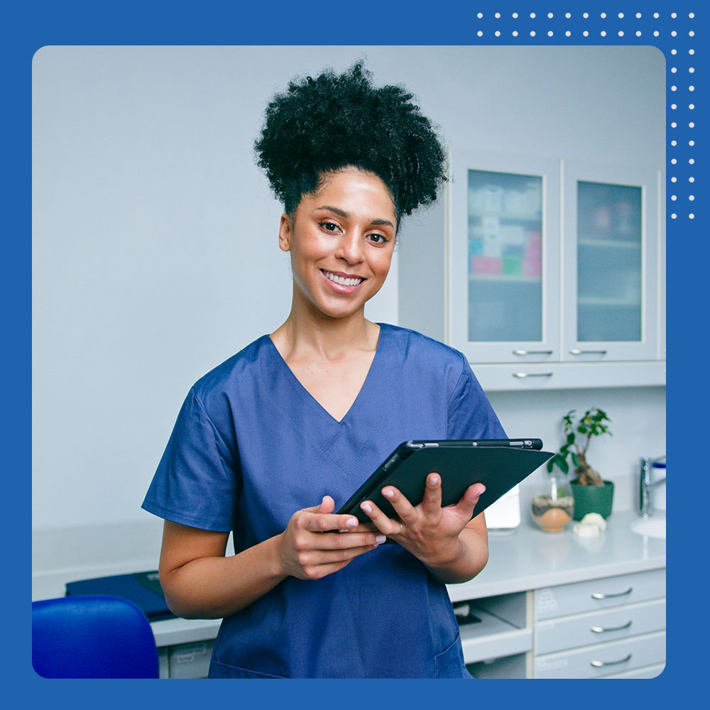 dental assistant holding tablet