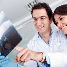 doctor and woman looking at xray